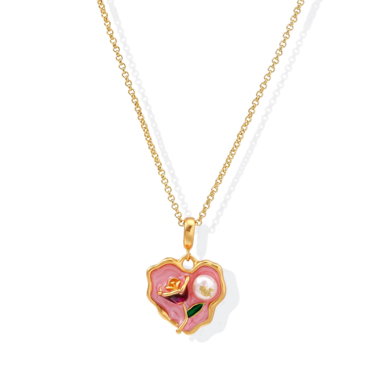 Heart-shaped pendant with pink enamel, rose design, freshwater pearl flower, and gold scalloped frame on delicate chain