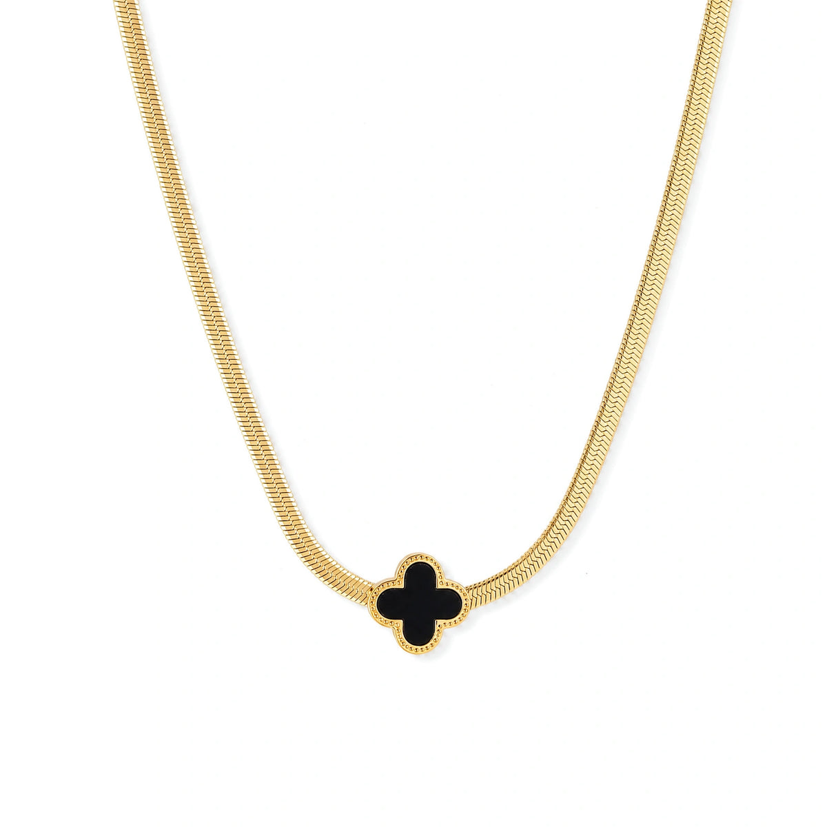 Dainty 18K gold-plated herringbone chain necklace with black enamel quatrefoil clover pendant on white background