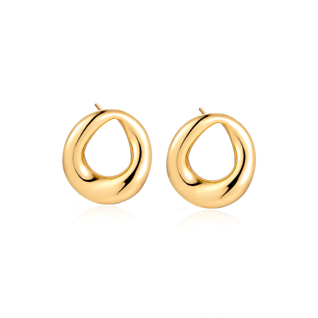 Pair of polished 18K gold-plated stainless steel teardrop earrings with hollow centers on cream background