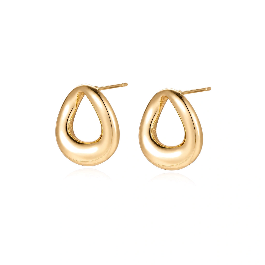 Pair of polished 18K gold-plated stainless steel teardrop earrings with hollow centers on cream background